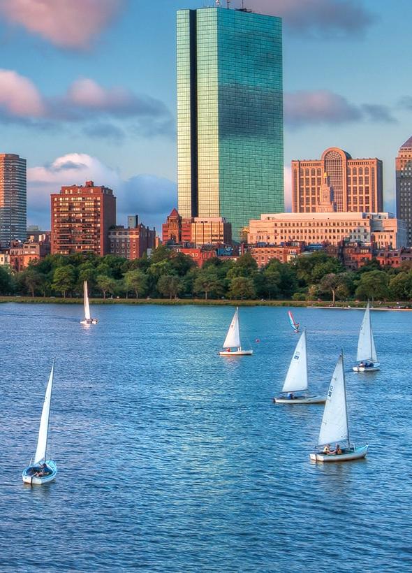 sailboats in front of Boston skyline