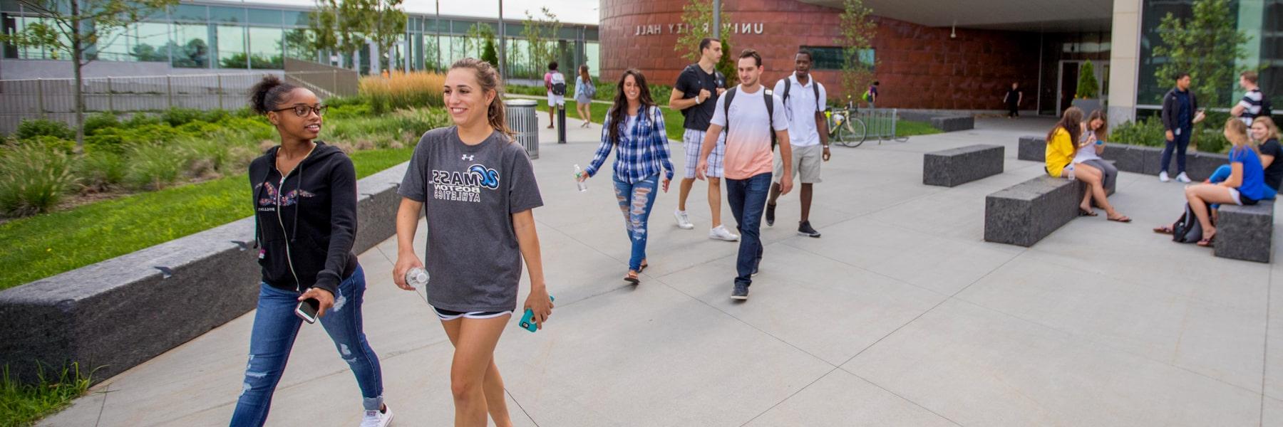 students walking outside university hall